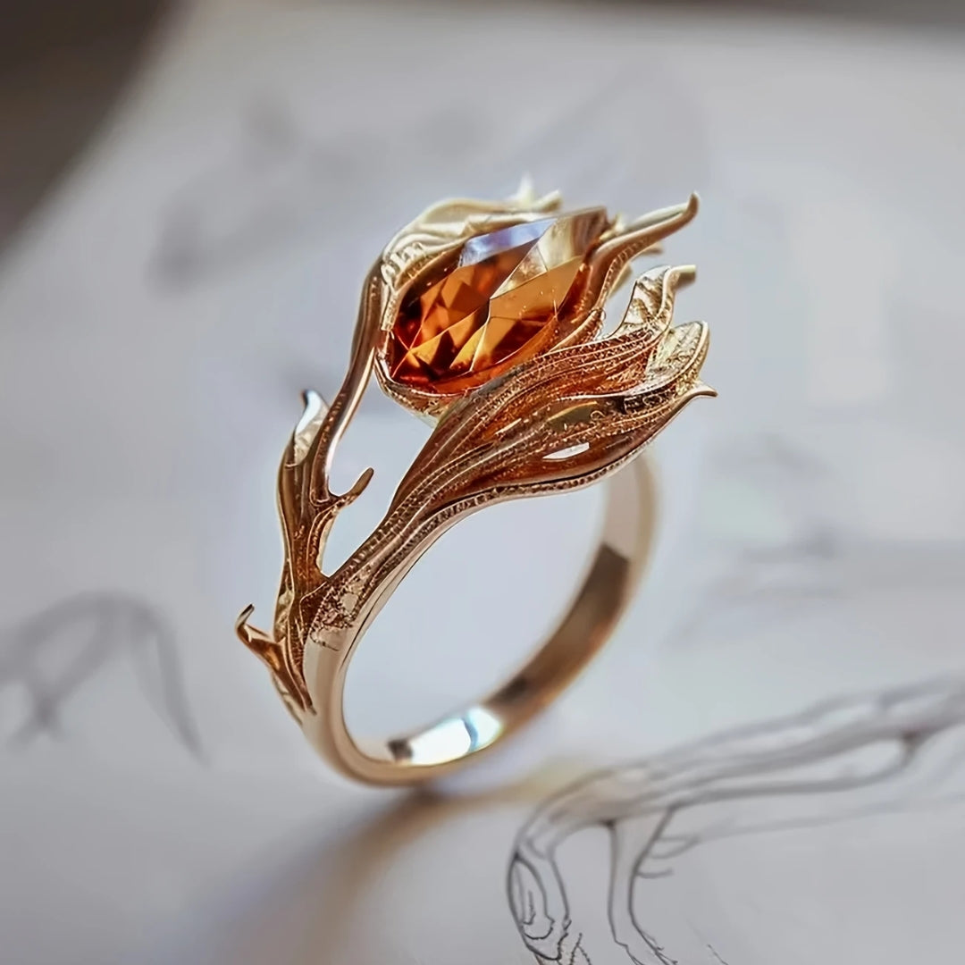 Gouden ring met oranje kristal