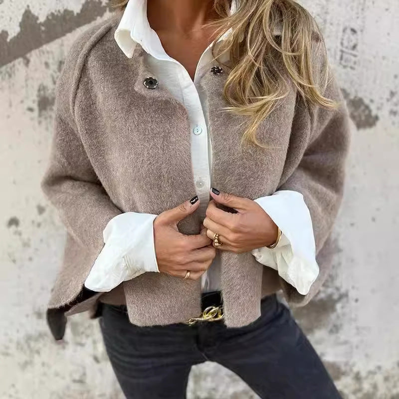 Kort elegant jasje met uitlopende mouwen